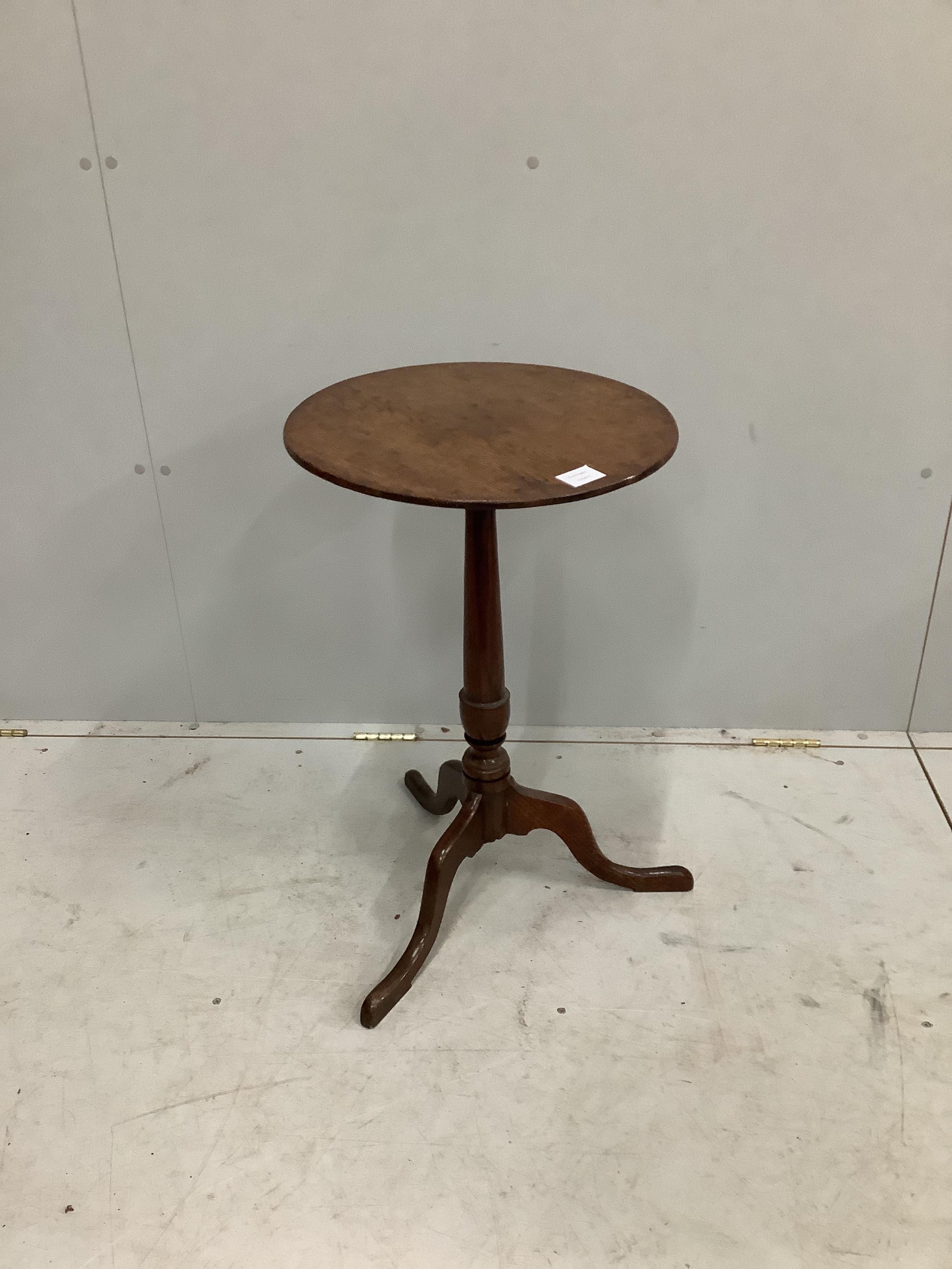 A George III circular oak tripod wine table, diameter 43cm, height 68cm